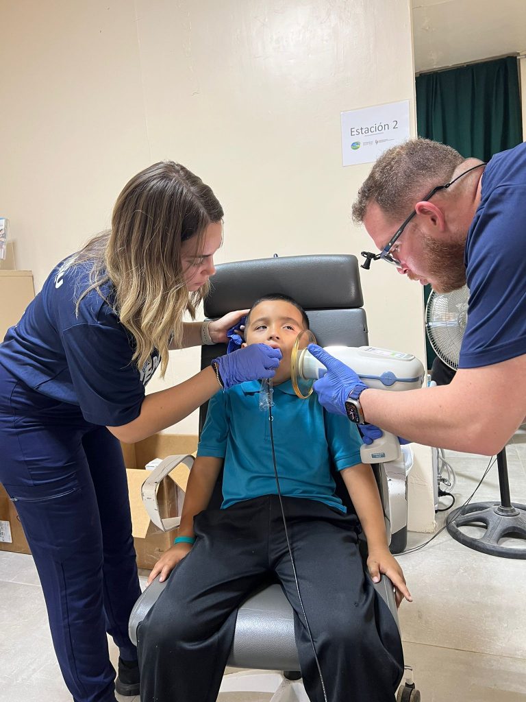 Volunteer dental team caring for a patient in Utuado, Puerto Rico