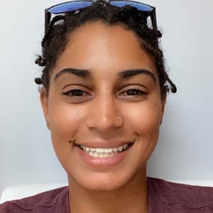 Smiling participant shown on the WVRF dental-care program page